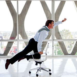 office worker riding on a chair mature age graduate law school