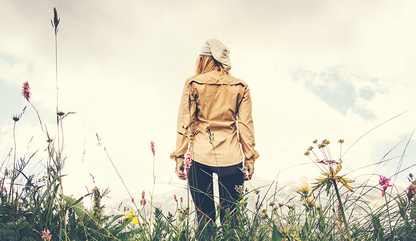 girl walking on flower fields establishing yourself as sole practitioner