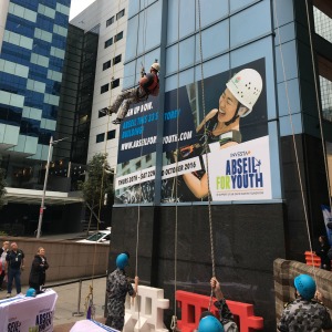 Adventurous associate abseils for a cause