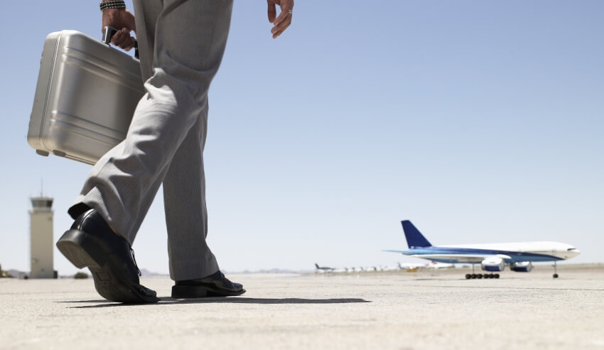 Business man carrying a briefcase