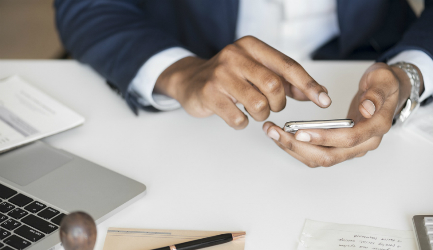 Australia's press freedom, mobile phone, man in suit