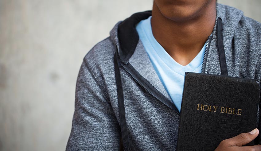 student with bible lw