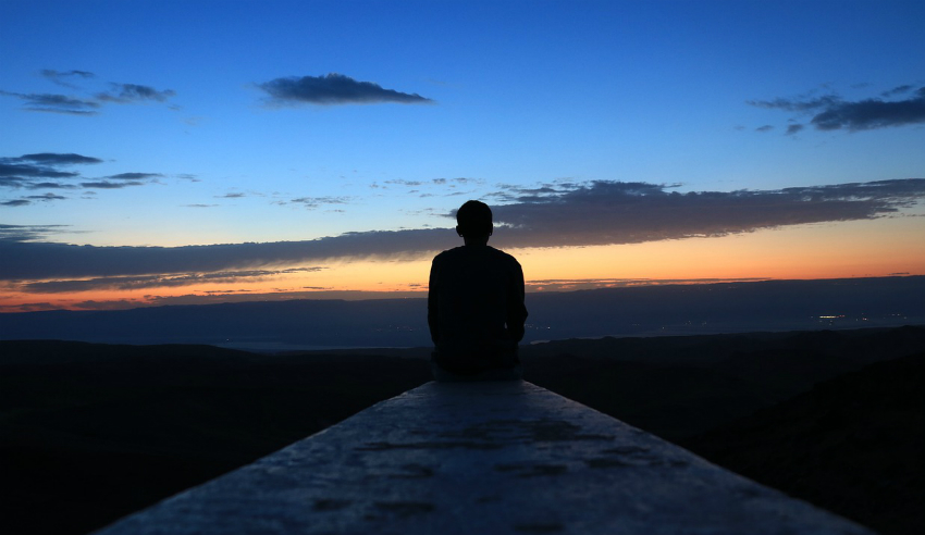 Sunrise, man looking at the sunrise