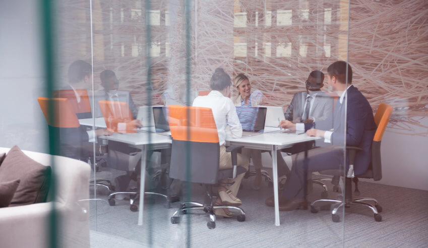 Team members in a board room